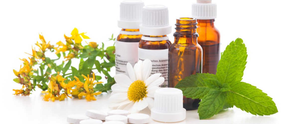 Healing herbs and medicinal bottles. Alternative medicine concept